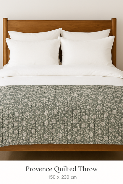 Lightly padded quilted bed throw in sage green, cotton blend fabric with detailed stitching, perfect for modern country home decor.