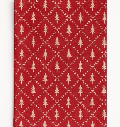 Traditional red Christmas runner with subtle tree pattern — festive table styling inspiration.