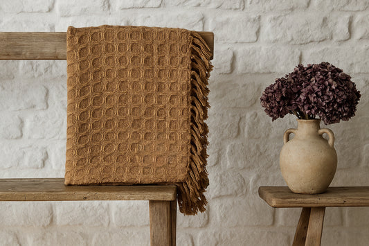 Walton & Co waffle throw in saffron – 100% cotton mustard blanket, 130x170cm, textured weave with tasselled edge for sofa or bed styling.