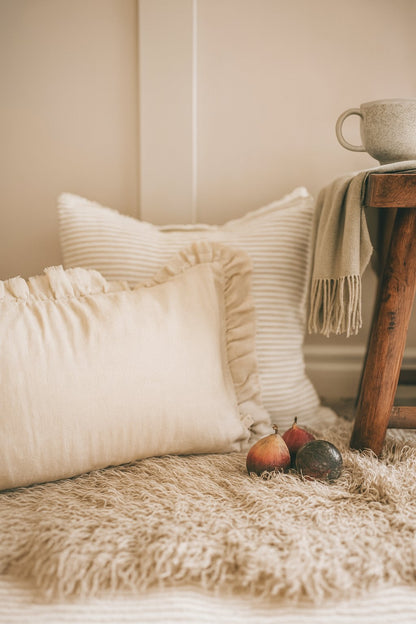 Cozy living room scene neutral cushions for country living