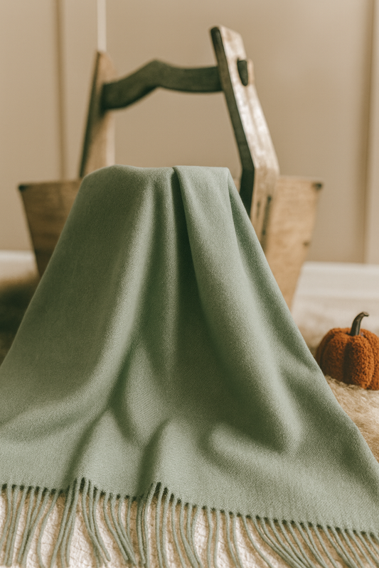 Sage green throw blanket for sofa or bed, cozy textured design, ideal for neutral interiors, farmhouse style, and modern country home décor.